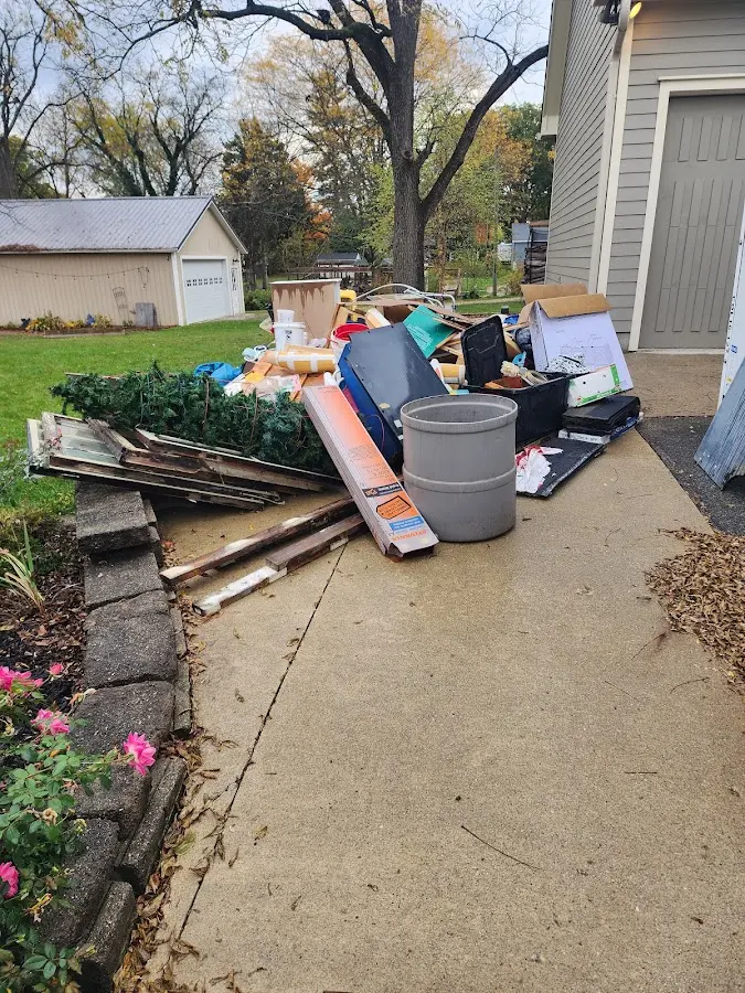 Dumpster being loaded with debris for 30 Yard Dumpster Rental in Ridgefield
